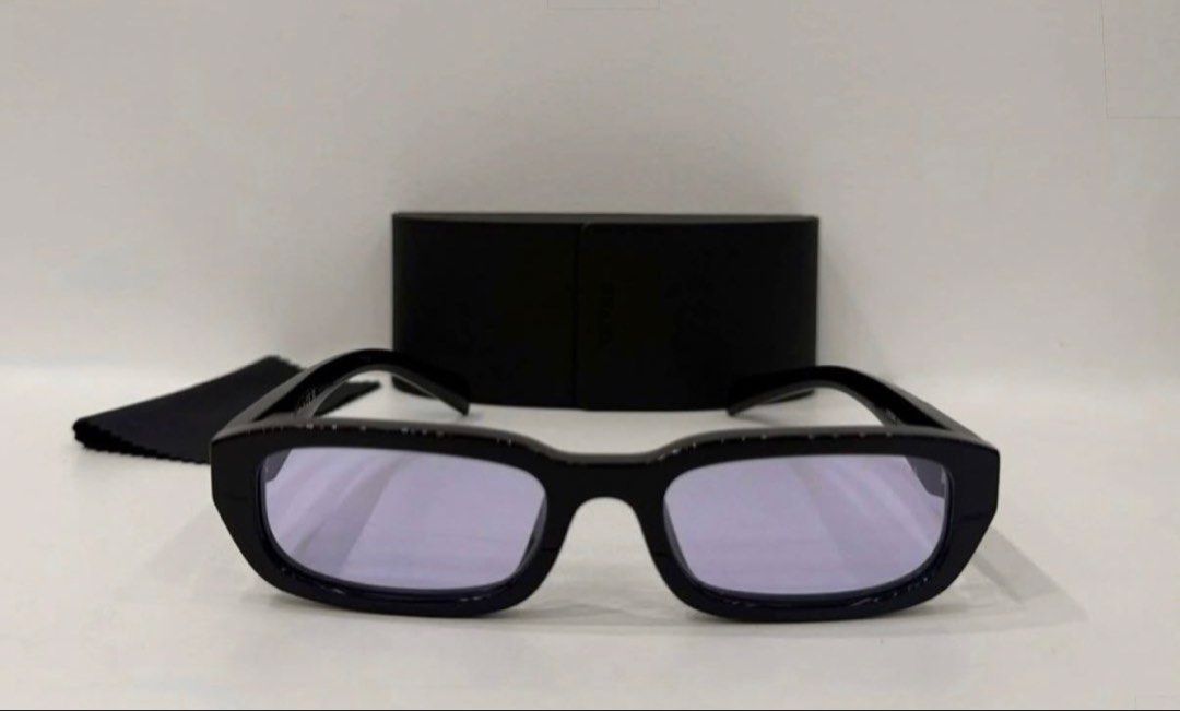 Prada SPR B06 Black Sunglasses (Original) (Category: Sunglasses & Eyewear) located in Manila. Submitted by casayuranhannahmae.1 (Listing ID 1466777207, Image 1). Description: - Original Prada sunglasses (Model SPR B06) - Chic black frame with stylish light purple lenses - Comes with original Prada case and cleaning cloth - Lens Width: 53mm, Bridge: 19mm, Temple Length: 145mm - A must-have accessory to elevate your look! - Inclusion: Prada sunglas