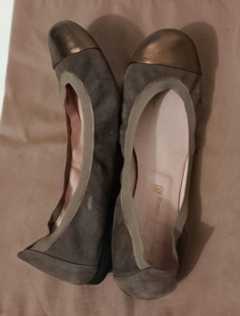 Pretty Ballerinas Suede Cap-Toe Flats (Category: Flats & Sandals) located in Paranaque City. Submitted by calm_youngstore7 (Listing ID 1466945066, Image 3). Description: Pretty Ballerinas Shirley suede ballet flats in a taupe or beige shade with a contrasting metallic cap-toe. - Style: Slip-on ballet flat with elasticized trim - Material: Taupe suede upper with metallic bronze cap-toe - Details: Gold logo stamped inside the heel - Condition: Inte