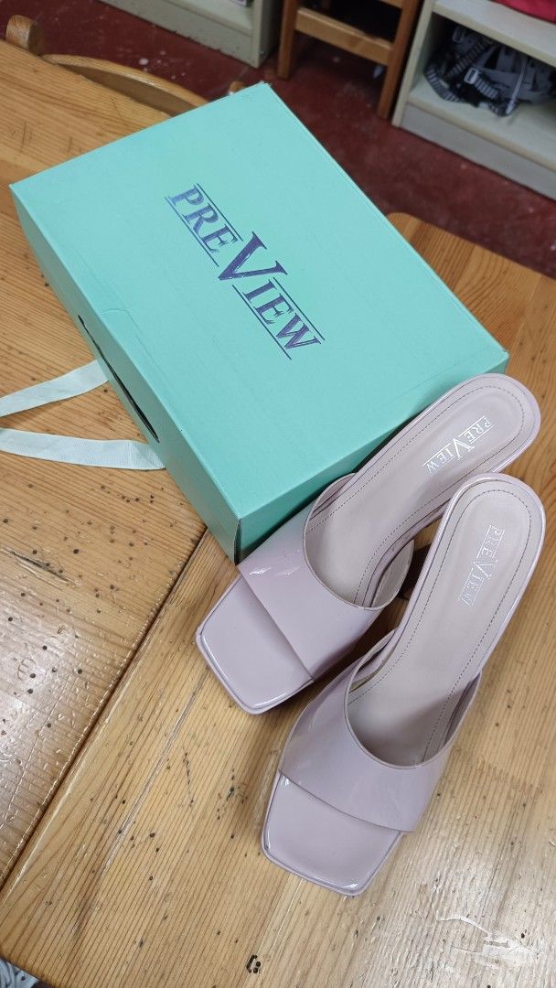 PREVIEW Block Heels & Hue (Category: Heels) located in Taguig. Submitted by rrdurant (Listing ID 1466873000, Image 2). Description: - Brand: PREVIEW - Style: Platform block heels with chunky square heel, wide front strap, and open toe - Color / Finish: Light pink patent finish - Condition: preloved - Inclusions: Original box from The Landmark and retail price tag (₱2,099.75) - Perfect for elevating any outfit while staying comfortable Hue Lime Ch