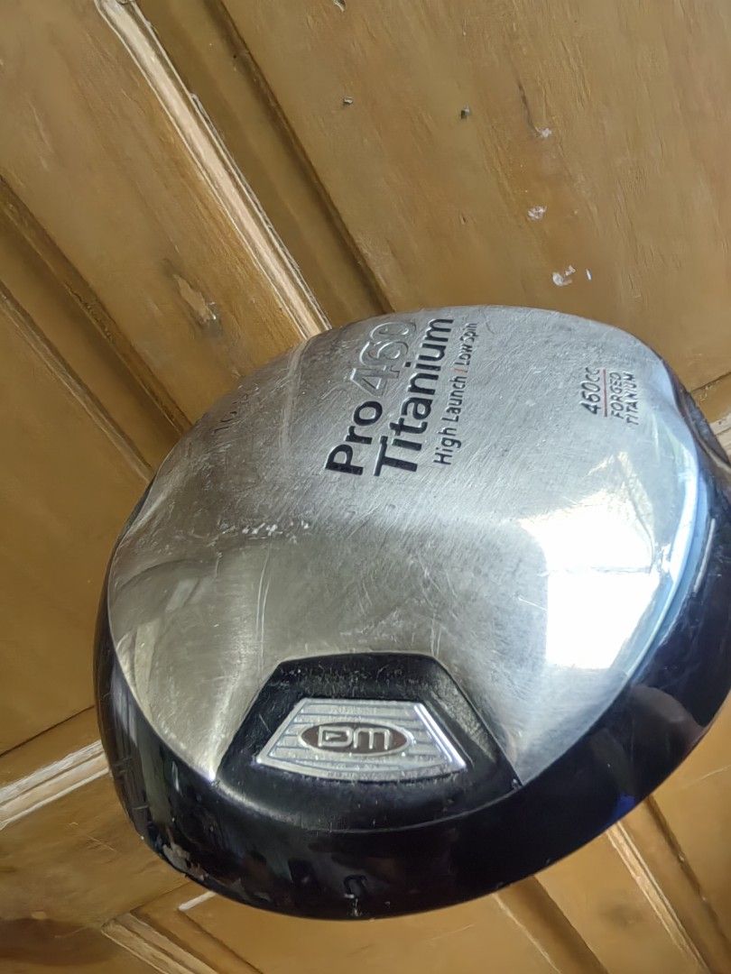 Pro 460 Titanium 10.5 Degree Golf Driver (Category: Golf) located in Silang. Submitted by jamessseller (Listing ID 1466918239, Image 2). Description: - Model: Pro 460 Titanium Driver - Loft: 10.5 degrees - Head Size: Large 460cc forged titanium head - Performance: High launch and low spin design for maximum distance - Shaft & Grip: Standard shaft with a stylish white grip section near the head - Condition: Normal wear and scratches on the metalli