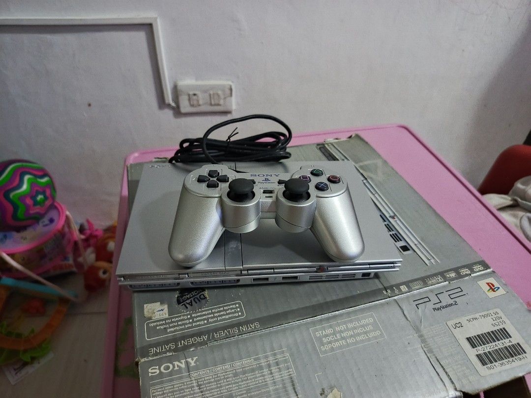 Ps2 Slim Satin Silver (Category: PlayStation) located in Manila. Submitted by milkenshie87625 (Listing ID 1466901686, Image 2). Description: With Box and Complete Manual. may bawas sa sure na kukuha. .