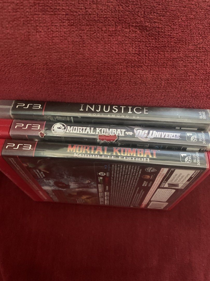 PS3 Games Bundle Injustice Mortal Kombat (Category: PlayStation) located in Makati City. Submitted by emenem.m (Listing ID 1466816813, Image 1). Description: - Bundle includes 3 PS3 fighting games: Injustice Gods Among Us, Mortal Kombat vs DC Universe, and Mortal Kombat Komplete Edition - Original cases included with clear spine labels (note: middle spine shows heavy wear and tears) - Discs are untested and sold strictly as a bundle pack.