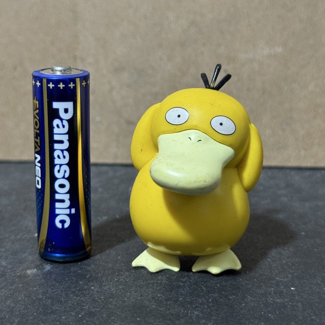 Psyduck Pokémon Mini Figurine (Category: Figurines & Statues) located in Cuyapo. Submitted by blacksheepshop (Listing ID 1466787173, Image 1). Description: - Authentic Pokémon Psyduck mini figure - Size: Smaller than an AA battery - Features: Classic confused expression and official copyright stamp underneath - Condition: Minor scuffs from display - Perfect for Pokémon fans and collectors.