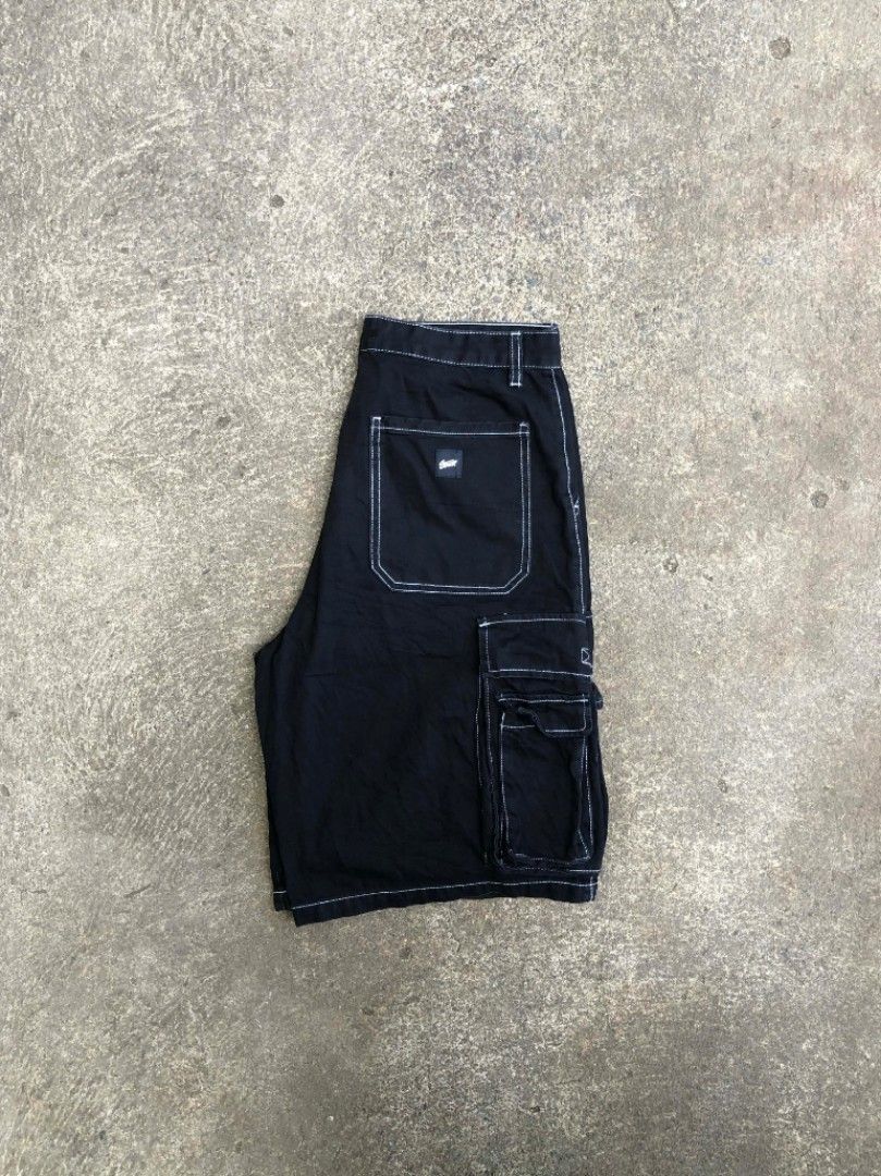 Pull & Bear Skater Fit Cargo Shorts Black Size 34 (Category: Shorts) located in Sipalay. Submitted by yon.thrifter (Listing ID 1466774669, Image 3). Description: - Brand: Pull & Bear - Style: Skater fit cargo shorts with contrast white stitching - Color: Black - Size: USA 34 / EUR 44 / MEX 34 - Features: Multiple side utility pockets, button closure, and belt loops - Origin: Made in Bangladesh - Condition: Excellent / Ready to wear.
