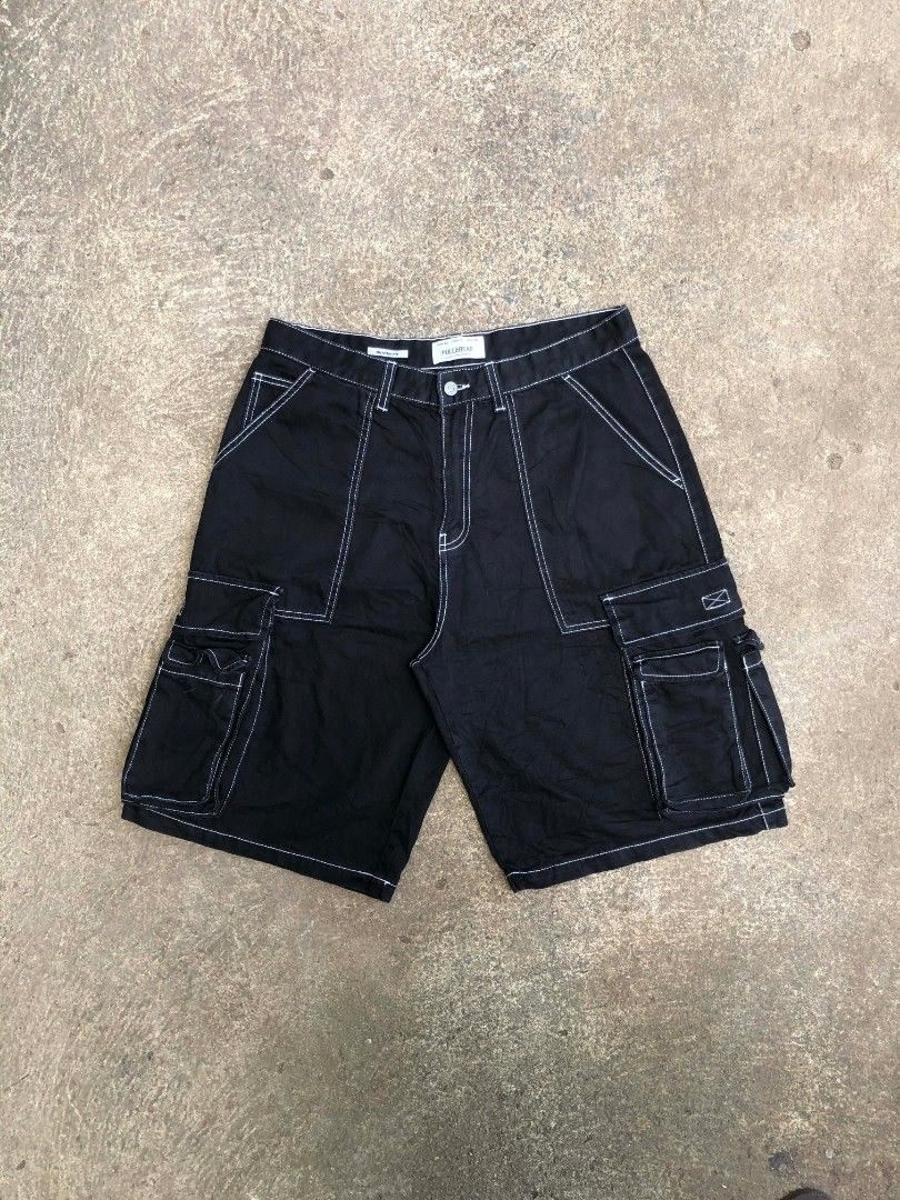 Pull & Bear Skater Fit Cargo Shorts Black Size 34 (Category: Shorts) located in Sipalay. Submitted by yon.thrifter (Listing ID 1466774669, Image 1). Description: - Brand: Pull & Bear - Style: Skater fit cargo shorts with contrast white stitching - Color: Black - Size: USA 34 / EUR 44 / MEX 34 - Features: Multiple side utility pockets, button closure, and belt loops - Origin: Made in Bangladesh - Condition: Excellent / Ready to wear.