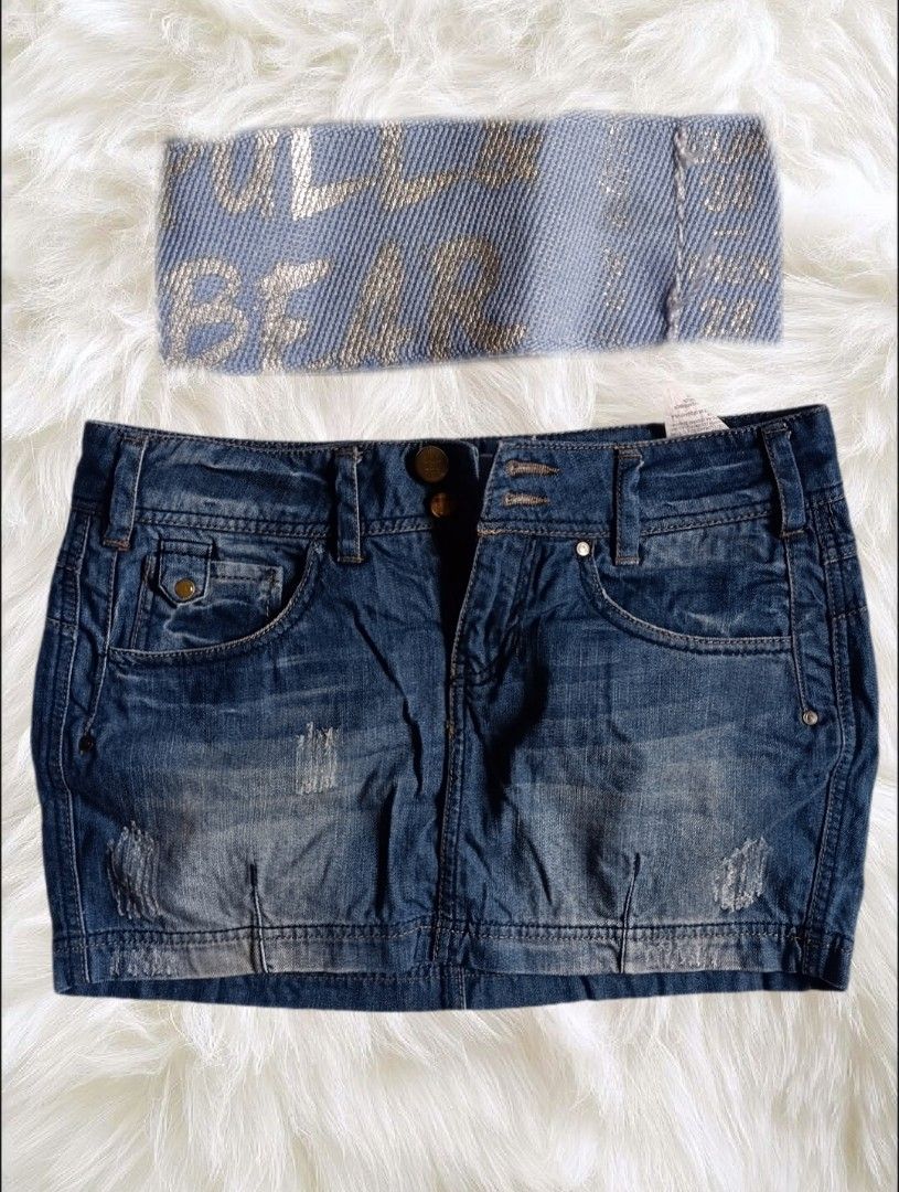 Pull&Bear Blue Denim Mini Skirt (Category: Skirts) located in Abucay. Submitted by lovedby.herrr (Listing ID 1466829284, Image 1). Description: Pull&Bear blue denim mini skirt in a low-rise style with light distressing, front pockets, and button closure. Comes with an elasticated logo waistband piece. Great for everyday casual wear..