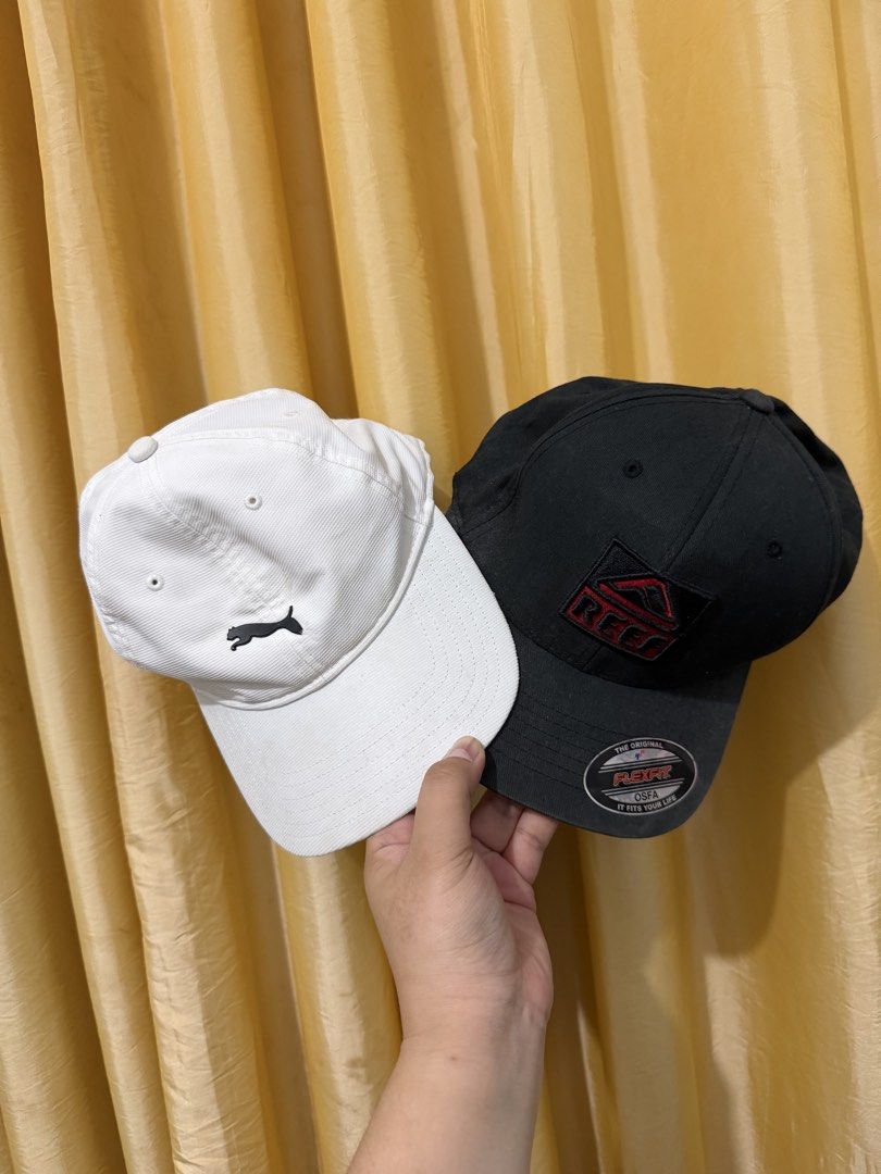 Puma Golf & Reef Flexfit Cap Bundle (Category: Caps & Hats) located in Binan City. Submitted by prelovedlagunaph (Listing ID 1466968191, Image 1). Description: - Bundle includes 2 caps: White Puma Golf cap with embroidered cat logo and black Reef cap with red embroidered patch - Structured crowns and clean interiors for a fresh look - Features Flexfit sizing sticker on the Reef brim and printed inner band on the Puma - Perfect everyday accessorie