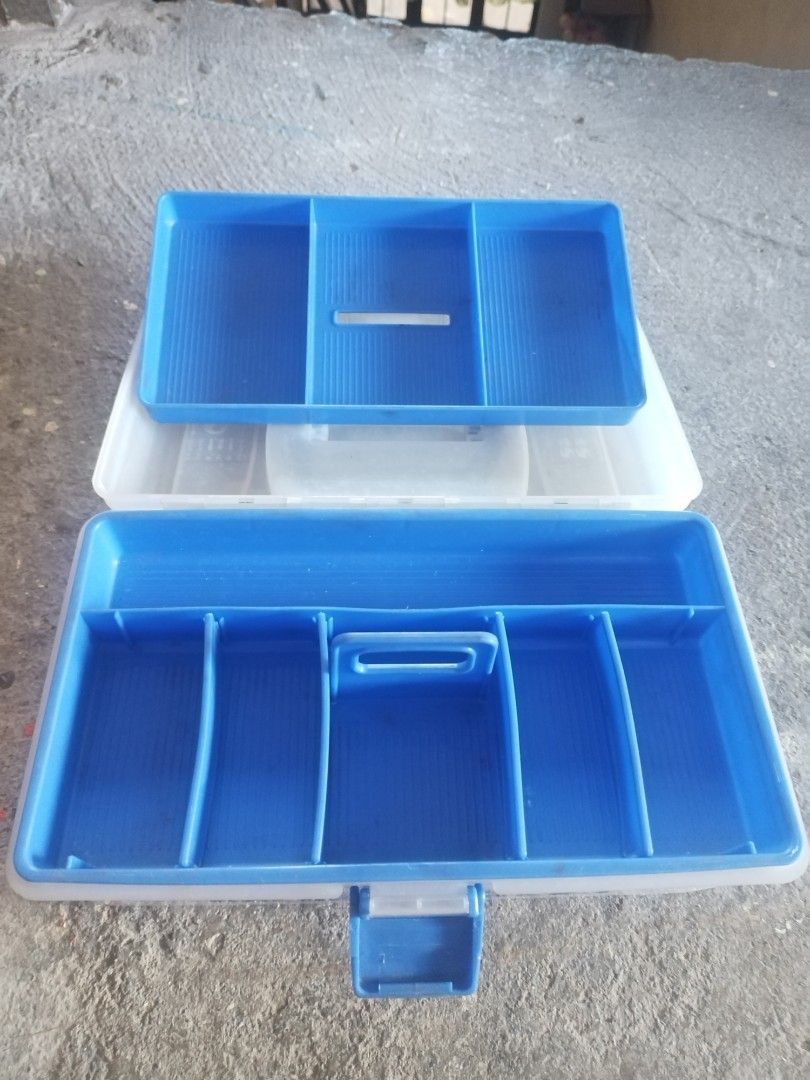 Racer's Box Tool Box (Category: Storage Boxes & Baskets) located in San Rafael. Submitted by jflshoppe1989 (Listing ID 1399848160, Image 3). Description: Tool box features a blue handle and a blue latch. The box is white and has the words "RACER'S BOX" printed on the front. It is sitting on a brown surface. The price is 450..