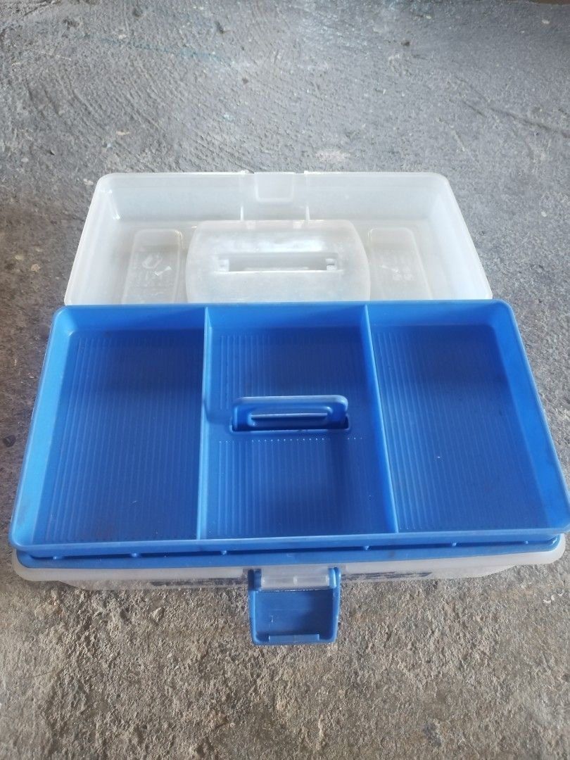 Racer's Box Tool Box (Category: Storage Boxes & Baskets) located in San Rafael. Submitted by jflshoppe1989 (Listing ID 1399848160, Image 2). Description: Tool box features a blue handle and a blue latch. The box is white and has the words "RACER'S BOX" printed on the front. It is sitting on a brown surface. The price is 450..