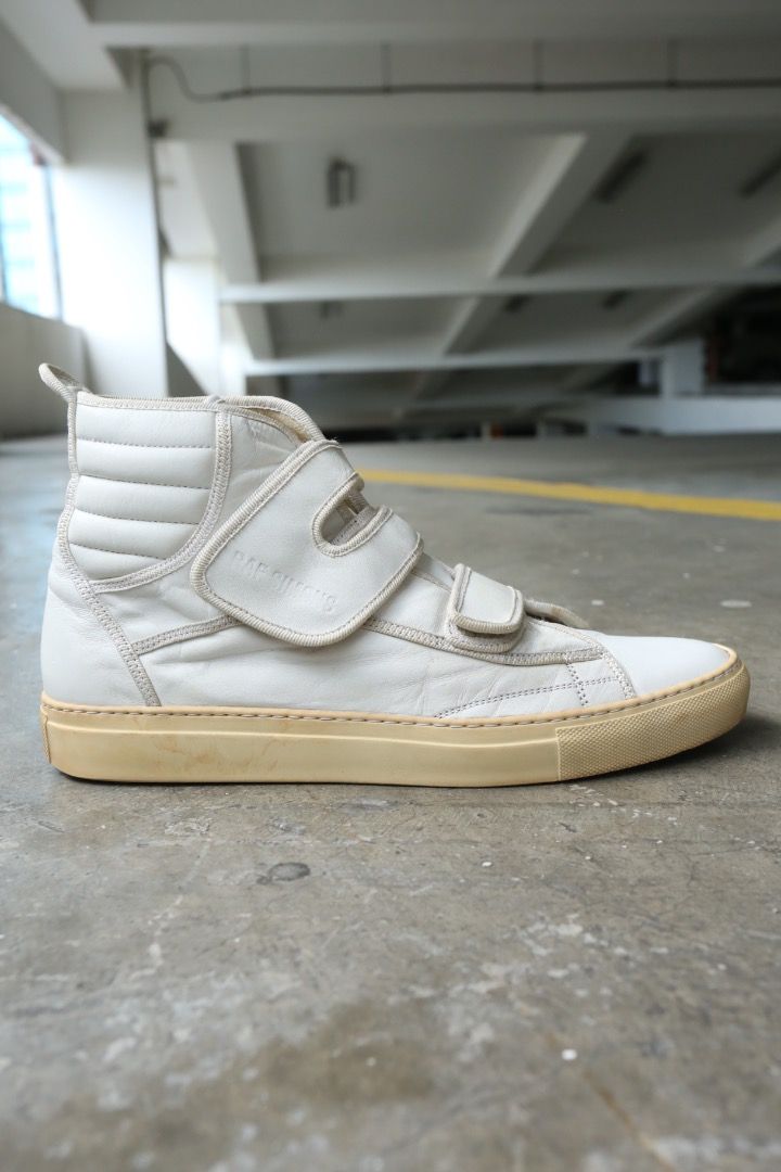 Raf Simons - S/S 05 - High-Top Velcro Sneakers (Category: Sneakers) located in Manila. Submitted by graymatter_ (Listing ID 1466847657, Image 2). Description: Raf Simons - S/S 05 - High-Top Velcro Sneakers OG release Tagged Size: 42 Condition: 8/10 Flaws: Signs of Usage, Minor Cracking of Outsole Material: Leather Made in: Italy.