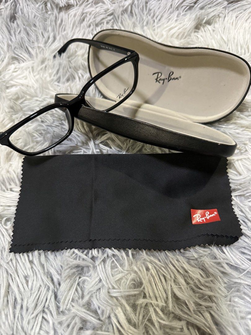 RayBan Prescription Glasses (Category: Vision Care) located in Muntinlupa City. Submitted by avampaya (Listing ID 1466902604, Image 3). Description: - Brand: Ray-Ban - Model: RB 7094D - Color: Glossy black - Size: 55-18 (140 mm temples) - Shape: Classic rectangular - Material: Lightweight acetate - Inclusions: Original hard case and branded black cleaning cloth with red logo patch - Condition: Excellent / Ready for your prescription lenses.
