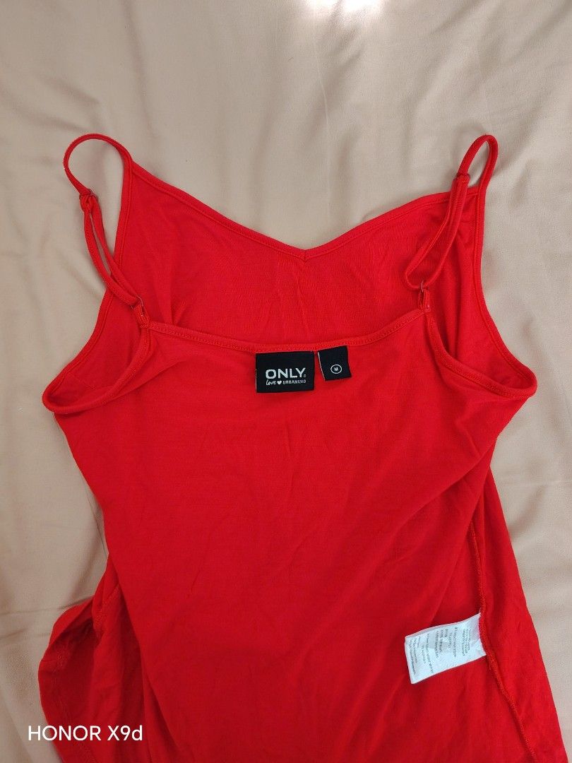 Red Cami Tank Top (Category: Sleeveless) located in Mabalacat. Submitted by Jackikay.PreLoved (Listing ID 1466849780, Image 2). Description: - Brand: ONLY - Size: M on tag but can fit S-L (super soft and stretchable) - Color: Red - Design: V-neck front with adjustable straps - Material: Soft, stretchy, and clean fabric .