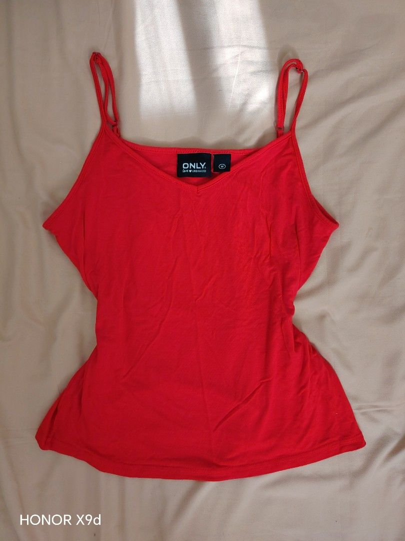Red Cami Tank Top (Category: Sleeveless) located in Mabalacat. Submitted by Jackikay.PreLoved (Listing ID 1466849780, Image 1). Description: - Brand: ONLY - Size: M on tag but can fit S-L (super soft and stretchable) - Color: Red - Design: V-neck front with adjustable straps - Material: Soft, stretchy, and clean fabric .