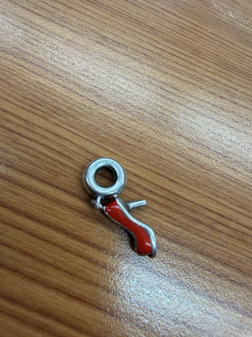 Red High Heel Shoe Charm Silver Dangle Bead (Category: Charms) located in Quezon City. Submitted by ellamenopi (Listing ID 1466776137, Image 2). Description: - Red high heel shoe charm with a shiny silver core loop - Features a bright red enamel finish and detailed open-toe design - Compatible with standard charm bracelets - Clean metal with minimal signs of wear - A fun addition to any charm collection.