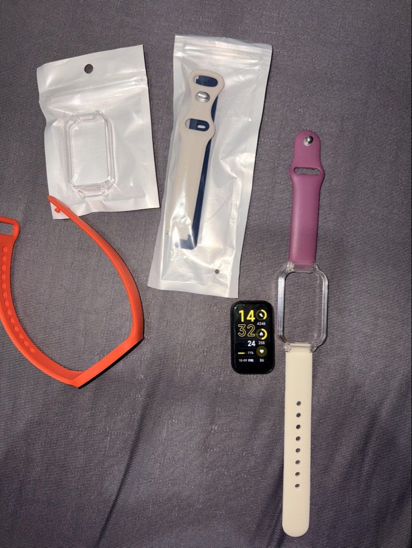 Redmi Smart Band 2 (Category: Wearables & Smart Watches) located in Pateros City. Submitted by aureamae_ (Listing ID 1466836081, Image 3). Description: - Brand/Model: Redmi Smart Band 2 - Condition: Pre-owned with minor screen scratches, fully functional - Includes Original charging cable - Purple & white strap used - Black & white strap with case & Orange - new .