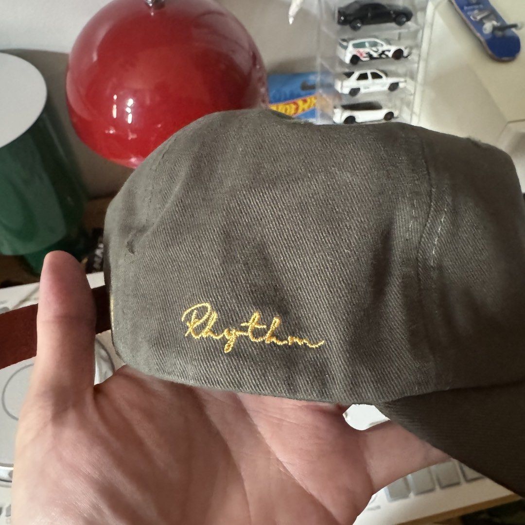 Rhythm Bouquet Cap Forest (Category: Caps & Hats) located in Silang. Submitted by 04th.street (Listing ID 1466848168, Image 3). Description: - Brand: Rhythm - Style: Bouquet Cap / Minimalist - Color: Forest Green - Design: Curved visor with front floral embroidery and back script logo - Closure: Adjustable brown PU leather strap with metal hardware - Condition: Brand new / Excellent quality - Perfect for everyday wear and easy styling.