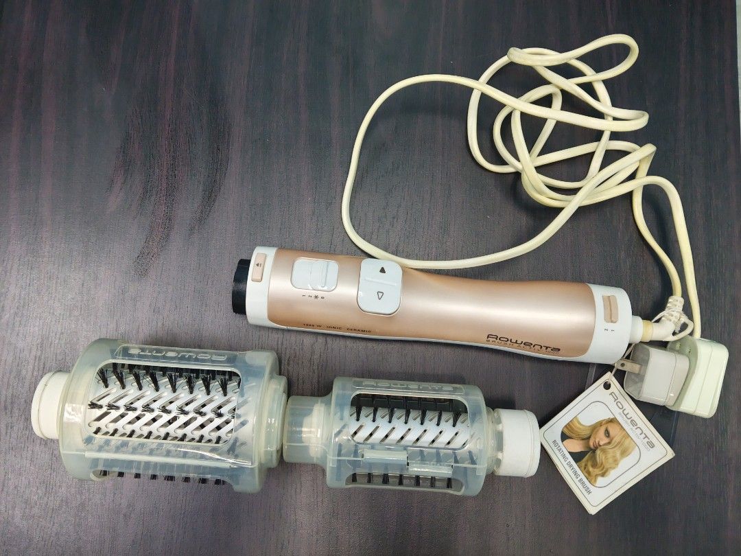 Rowenta Brush Activ 1000 Rotating Drying Brush (Category: Hair) located in Manila. Submitted by artsylove24 (Listing ID 1466787128, Image 1). Description: - Brand: Rowenta Brush Activ 1000 - Color: Chic Rose Gold and White - Power: 1000W with ionic and ceramic technology for frizz-free shine - Features: Automatic rotation with easy directional buttons - Attachments: Includes two interchangeable brush heads for drying and styling simultaneously - 