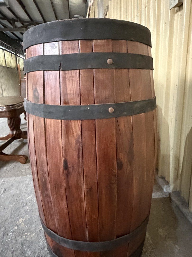 Rustic Wooden Barrel Storage Decor (Category: Shelves, Cabinets & Racks) located in Las Pinas. Submitted by bluemieeeee (Listing ID 1466844155, Image 2). Description: - wood construction with rich brown grain finish - Accented with dark bands and visible rivet details - Heavy-duty build that stands firmly on flat ground - Ideal for rustic home decor, display props, or DIY projects - 2 identical pieces available (purchase as set).