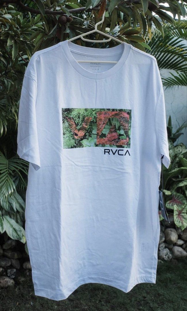 RVCA White Graphic T-Shirt (Category: Tshirts & Polo Shirts ) located in Cebu City. Submitted by declutterbarbie_ (Listing ID 1466832334, Image 1). Description: - Brand: RVCA - Color: White - Fit: Regular fit - Design: Botanical plant imagery with RVCA lettering in a chest box - Details: Tagged on the side seam - Sizes: Medium and Large - Condition: Brand new / clean piece - Perfect for casual daily wear.