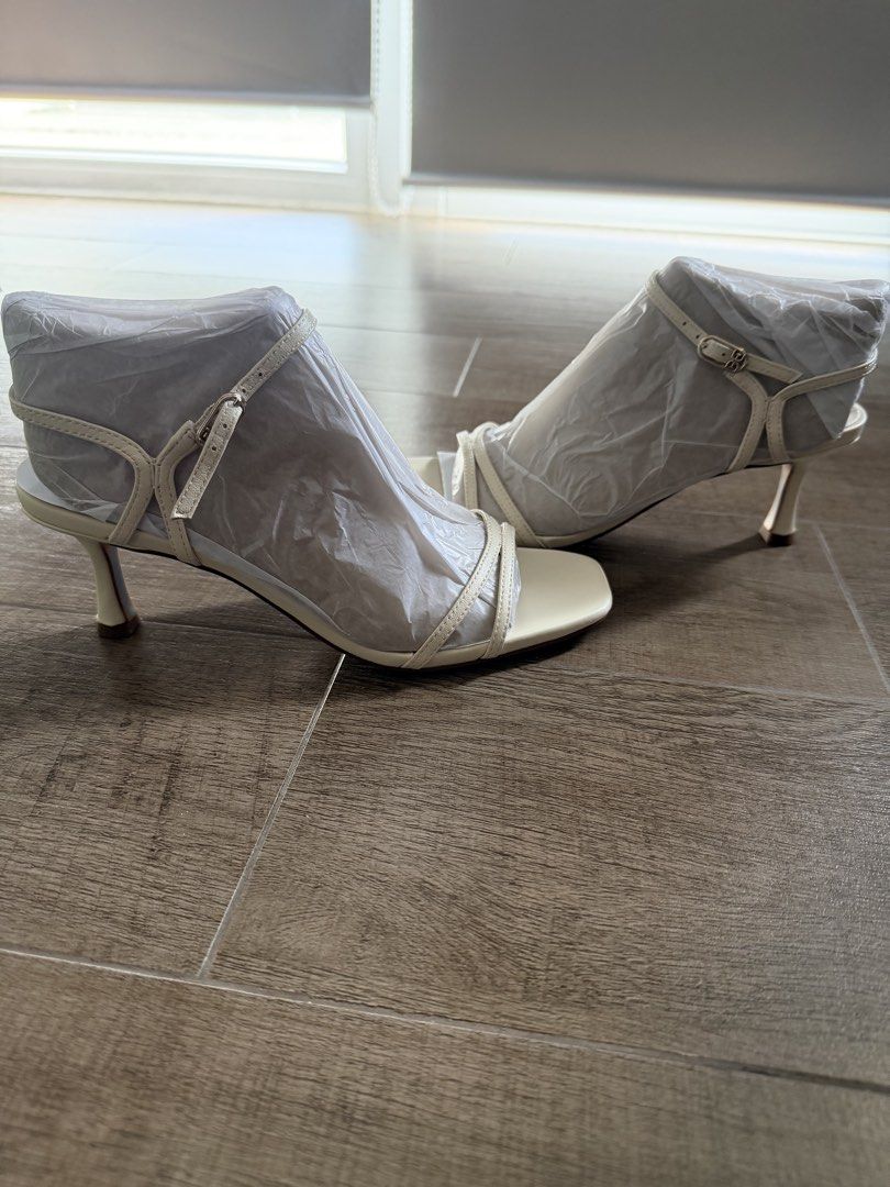 Sam Edelman Presley Cream Heeled Sandals (Category: Heels) located in Taguig. Submitted by mrs.k.see (Listing ID 1466844703, Image 2). Description: Sam Edelman Presley sandals in cream. Strappy design with a square toe and kitten heel. Adjustable ankle strap with buckle closure. Leather upper, balance man made. Soles completely clean, never worn outdoors. Original packing paper still stuffed inside both shoes..