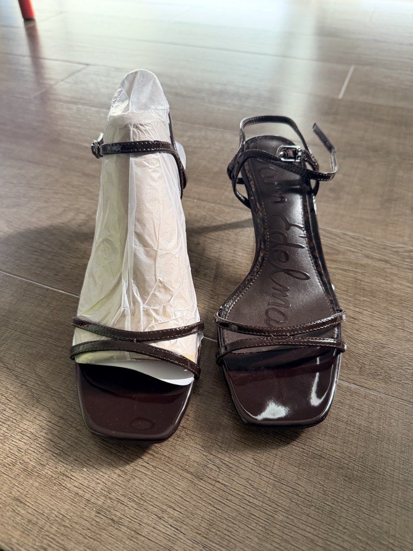 Sam Edelman Presley Patent Brown Sandals Heels (Category: Heels) located in Taguig. Submitted by mrs.k.see (Listing ID 1466844962, Image 1). Description: Sam Edelman Presley heels in dark brown patent leather. Strappy design with square toe and slim kitten heel. Ankle strap with buckle closure. Size US 6.5 / EUR 36.5. Pristine soles with stickers still attached, paper stuffing inside. Never worn..
