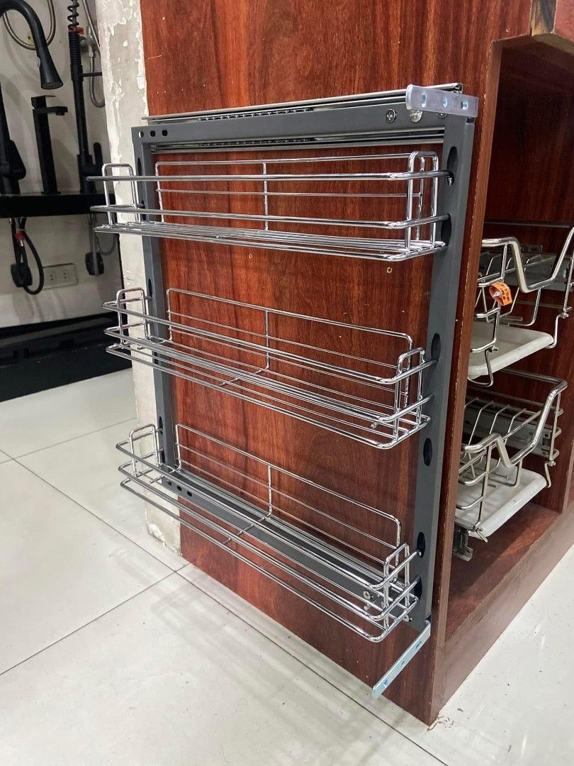 SC200-3Layers Pull Out Kitchen Spice Rack Basket (Category: Food Organization & Storage) located in Manila. Submitted by jamfrimzy089458 (Listing ID 1466833284, Image 2). Description: - Model: SC200-3Layers pull-out spice rack for kitchen cabinets - 3 tiers of durable chrome wire baskets - Sturdy grey frame equipped with smooth sliding tracks - Dimensions: approx. 150mm (W) x 470mm (D) x 550mm (H) - Keeps spice jars and bottles neat and easily ac