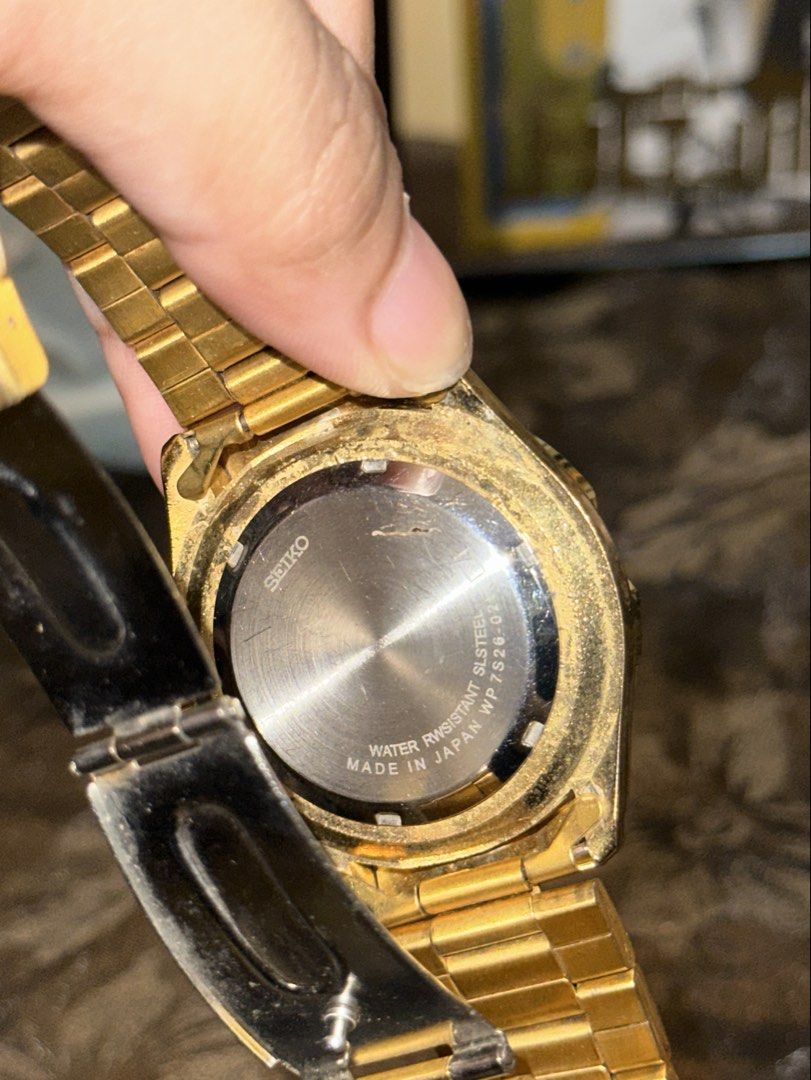 Seiko 5 Automatic Gold Tone Diver Watch (Category: Men's Watches) located in Manila. Submitted by tenshiii185 (Listing ID 1466902899, Image 2). Description: - Brand/Model: Seiko 5 Automatic (Case Back: 7S26-02K0) - Movement: Made in Japan, 21 Jewels - Dial & Features: Textured gold-tone dial with day and date window at 3 o'clock, rotating bezel - Strap: Matching metal bracelet with folding clasp - Condition: Pre-owned with visible scuffs, scratch
