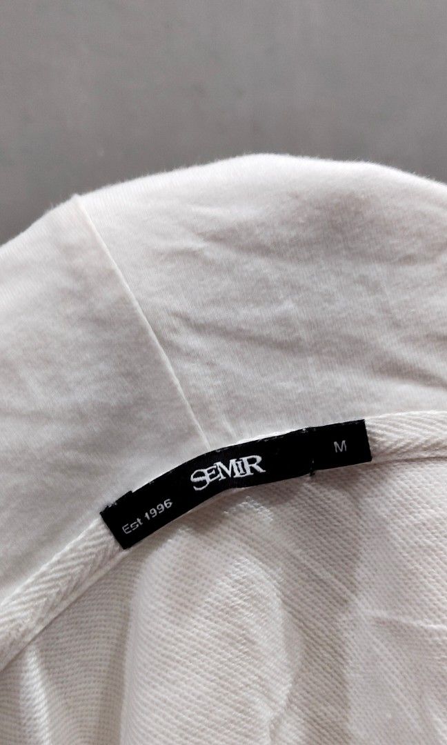SEMIR White Hoodie (Category: Coats, Jackets and Outerwear) located in Manila. Submitted by yheen_shark (Listing ID 1466799581, Image 2). Description: SEMIR White Hoodie — Size M Description: ✅ BRAND: SEMIR (Est. 1996) ✅ Color: Clean White ✅ Size: Medium — comfortable fit ✅ Design: Royal Flush / Poker-inspired print sa likod ✅ Tag: "YOUTH IDEALIST" — unique style ✅ Material: Cotton fleece — malambot, makapal, at presko ✅ Condition: Gently used — 