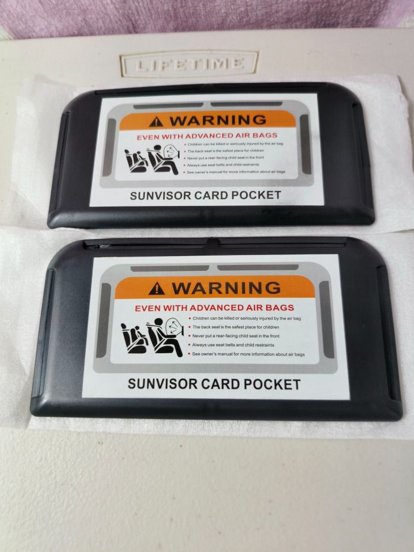 Set of 2 Car Sunvisor Card Pockets (Category: Wallets & Card holders) located in San Leonardo. Submitted by burgossanleonardo.12345 (Listing ID 1466896067, Image 2). Description: - Set of 2 sleek black car sun visor card holders - Dimensions: approx. 15 cm x 6.5 cm each - Keeps cards, tickets, and small documents neat and within easy reach - Features a stylish warning label graphic on the front flap - Perfect accessory for a clutter-free and orga