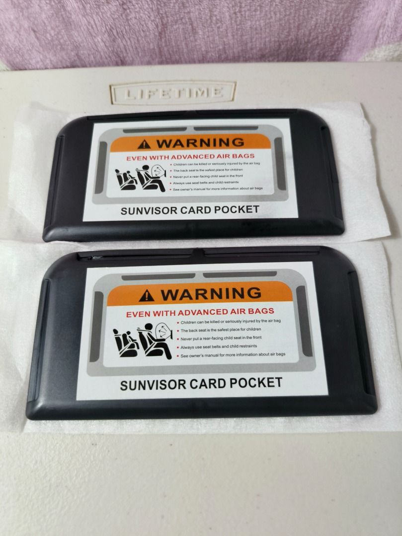 Set of 2 Car Sunvisor Card Pockets (Category: Wallets & Card holders) located in San Leonardo. Submitted by burgossanleonardo.12345 (Listing ID 1466896067, Image 1). Description: - Set of 2 sleek black car sun visor card holders - Dimensions: approx. 15 cm x 6.5 cm each - Keeps cards, tickets, and small documents neat and within easy reach - Features a stylish warning label graphic on the front flap - Perfect accessory for a clutter-free and orga