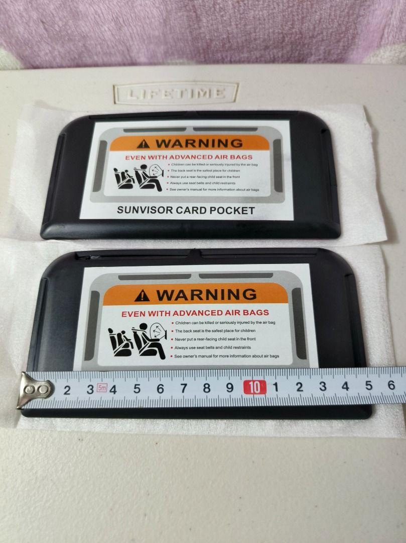 Set of 2 Car Sunvisor Card Pockets (Category: Wallets & Card holders) located in San Leonardo. Submitted by burgossanleonardo.12345 (Listing ID 1466896067, Image 3). Description: - Set of 2 sleek black car sun visor card holders - Dimensions: approx. 15 cm x 6.5 cm each - Keeps cards, tickets, and small documents neat and within easy reach - Features a stylish warning label graphic on the front flap - Perfect accessory for a clutter-free and orga