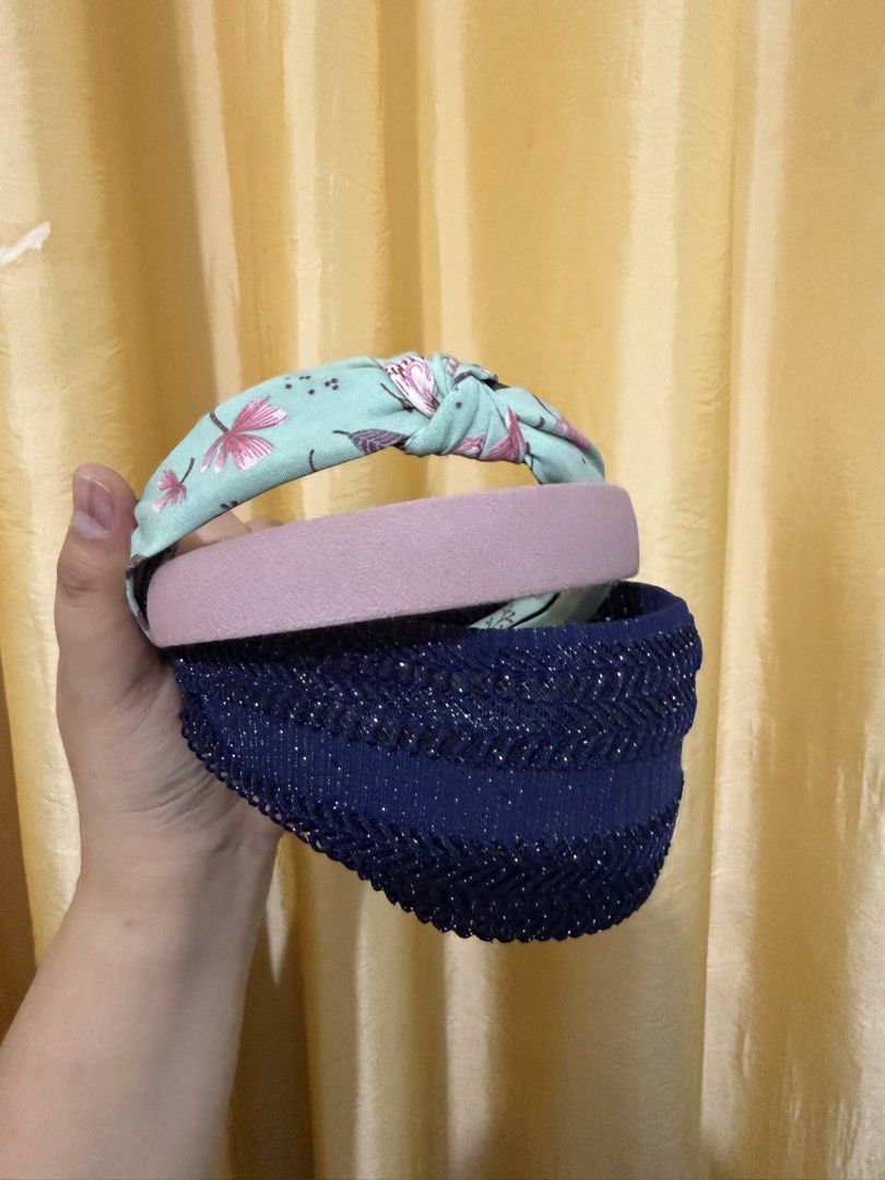 Set of 3 Assorted Headbands (Category: Hair Accessories) located in Binan City. Submitted by prelovedlagunaph (Listing ID 1466968127, Image 3). Description: - Set of 3 stylish and comfortable headbands - Includes light blue floral top-knot design, plain dusty pink, and sparkly dark blue knit - All-day comfort without fuss - Perfect for quick and easy daily hairstyles.