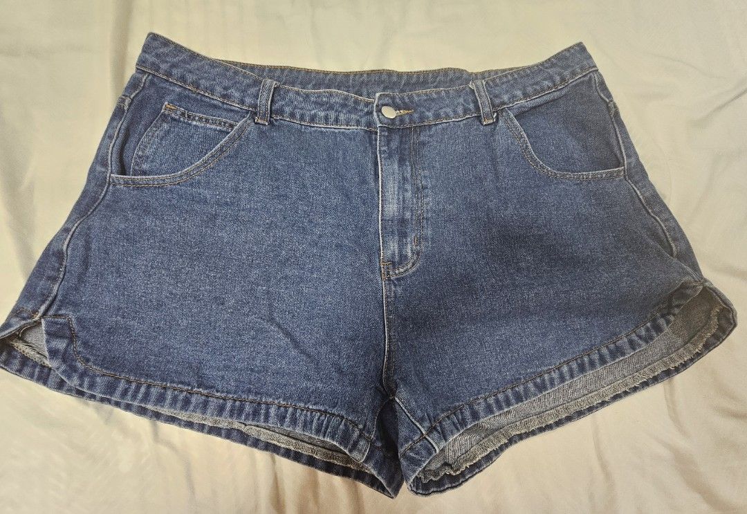 Shein Denim Shorts plus size 2XL (Category: Shorts) located in Santo Tomas. Submitted by buybugs (Listing ID 1466964866, Image 1). Description: - Brand: SHEIN Curve - Size: 2XL - Color: Medium blue wash - Condition: lightly used - Details: Classic 5-pocket style, button and zipper fly, stylish curved side hem - Fit/Style: Casual everyday wear, perfect for warmer days - Make: Denim non-stretch.