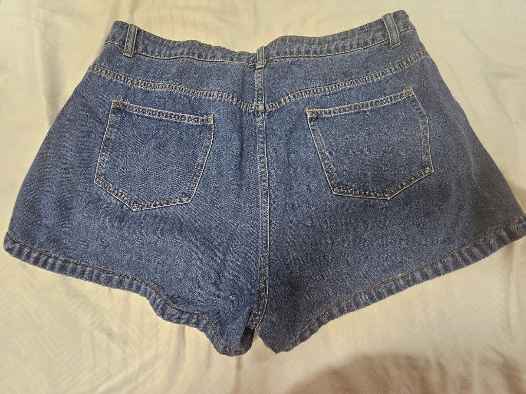 Shein Denim Shorts plus size 2XL (Category: Shorts) located in Santo Tomas. Submitted by buybugs (Listing ID 1466964866, Image 2). Description: - Brand: SHEIN Curve - Size: 2XL - Color: Medium blue wash - Condition: lightly used - Details: Classic 5-pocket style, button and zipper fly, stylish curved side hem - Fit/Style: Casual everyday wear, perfect for warmer days - Make: Denim non-stretch.