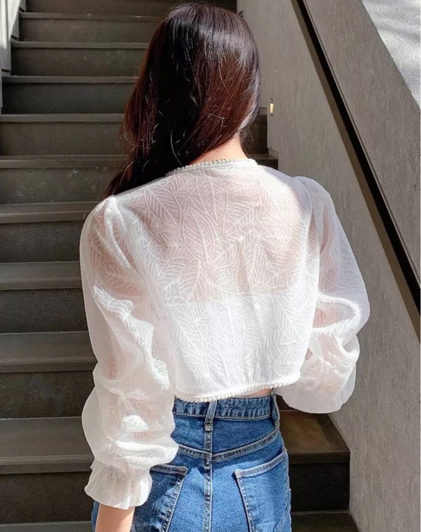 Shein Korean Style White Sheer Leaf Pattern Crop Cardigan (Category: Coats, Jackets and Outerwear) located in Manila. Submitted by goddesssy (Listing ID 1466877978, Image 2). Description: - Color & Style: White sheer crop cardigan with leaf patterns - Details: Puff sleeves and delicate pearl trim along the neckline and front edge - Fabric: Lightweight, great for layering over tanks or camisoles - Styling Tip: Perfect to pair with high-waisted den