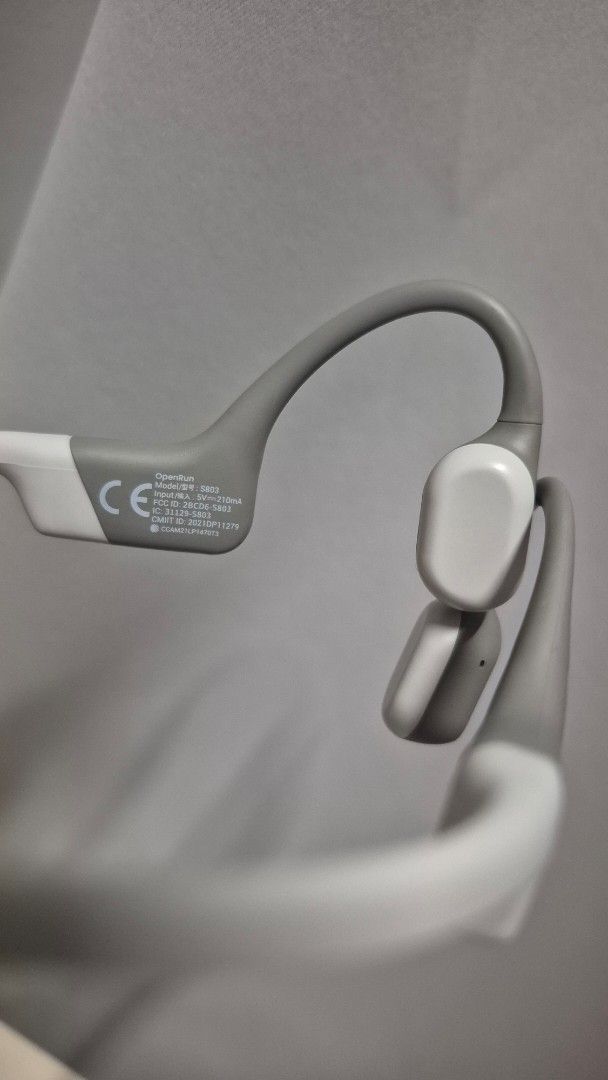 Shokz OpenRun Bone Conduction Headphones (Category: Headphones & Headsets) located in Manila. Submitted by beibeidd (Listing ID 1466874134, Image 2). Description: - Model: Shokz OpenRun S803 - Color: Stylish grey and white - Design: Open-ear bone conduction for safe workouts and ambient awareness - Condition: Fully functional and meticulously maintained - Inclusions: Original matching grey Shokz drawstring storage pouch.