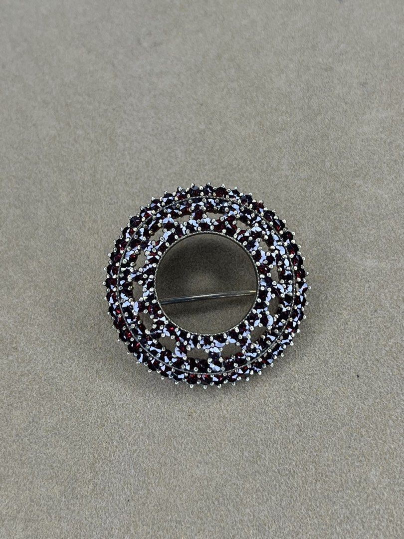 Silver Vintage Garnet Circular Cluster Brooch Pin (Category: Brooches) located in Bulacan. Submitted by vintagetreasureby.mivida (Listing ID 1466957643, Image 3). Description: Round openwork brooch covered entirely in deep red garnet gemstones. Secure pin clasp on the reverse side with pierced metal backing to let the light through the stones. Measures a handy size for jackets, scarves, or lapels. Classic heirloom look, heavy clustering of tiny c