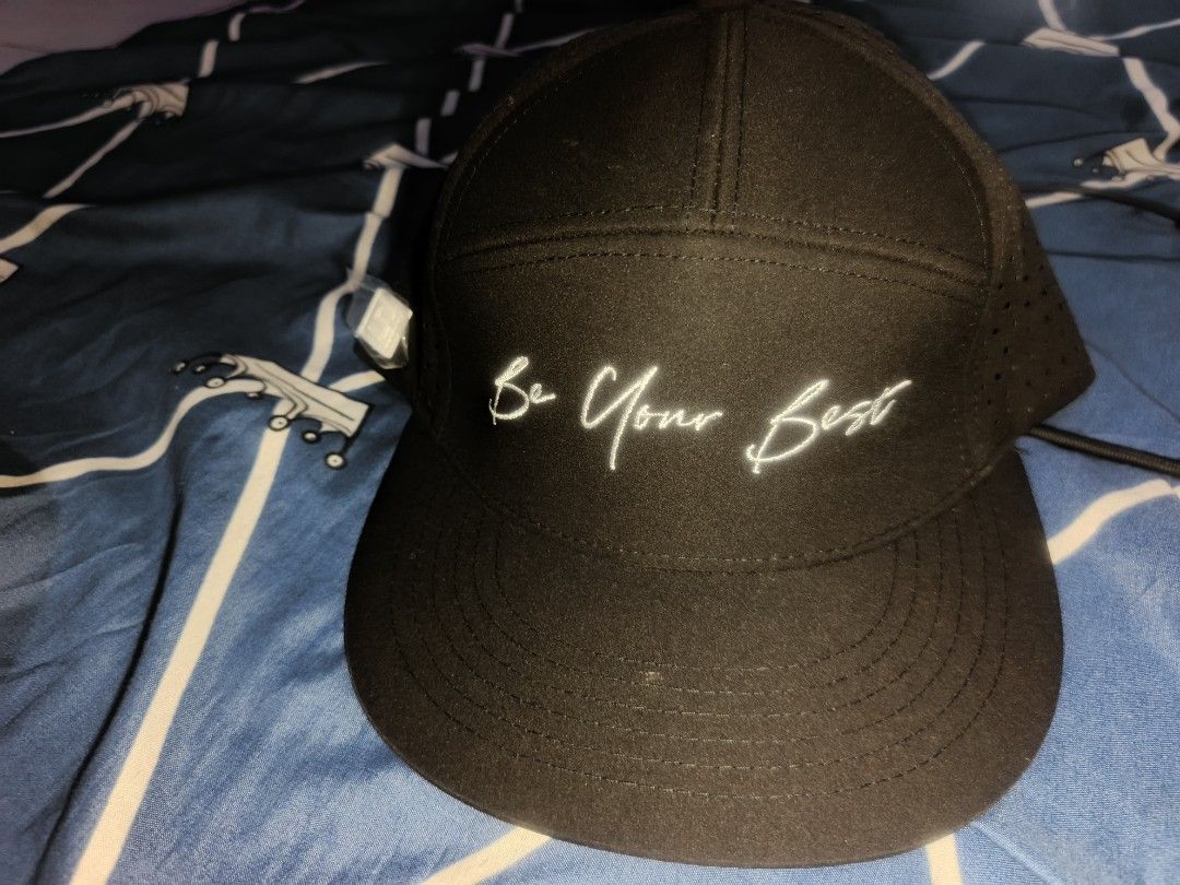 Simpler Be Your Best Black Cap 5 pannel (Category: Caps & Hats) located in Manila. Submitted by julianivan50757 (Listing ID 1466954004, Image 1). Description: - Brand: Simpler - Color: Black with white embroidered 'Be Your Best' text - Breathable: Perforated mesh side panels for extra airflow - Details: Branded taping lines the inside seams - Style: Flat brim.