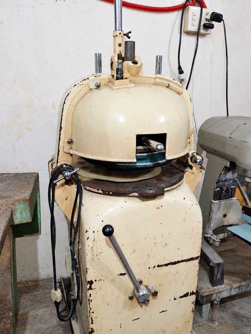 SINMAG Dough Divider Rounder (Category: Industrial Equipment) located in Dasmarinas. Submitted by jeannemaika (Listing ID 1466807509, Image 1). Description: SINMAG Dough Divider 📍Sariaya, Quezon - Industrial dough divider and rounder machine for high-volume bakery operations - Sturdy heavy-duty metal construction built to last - Features a manual lever mechanism on the front panel and attached power cord - Cream-colored exterior shows visible co