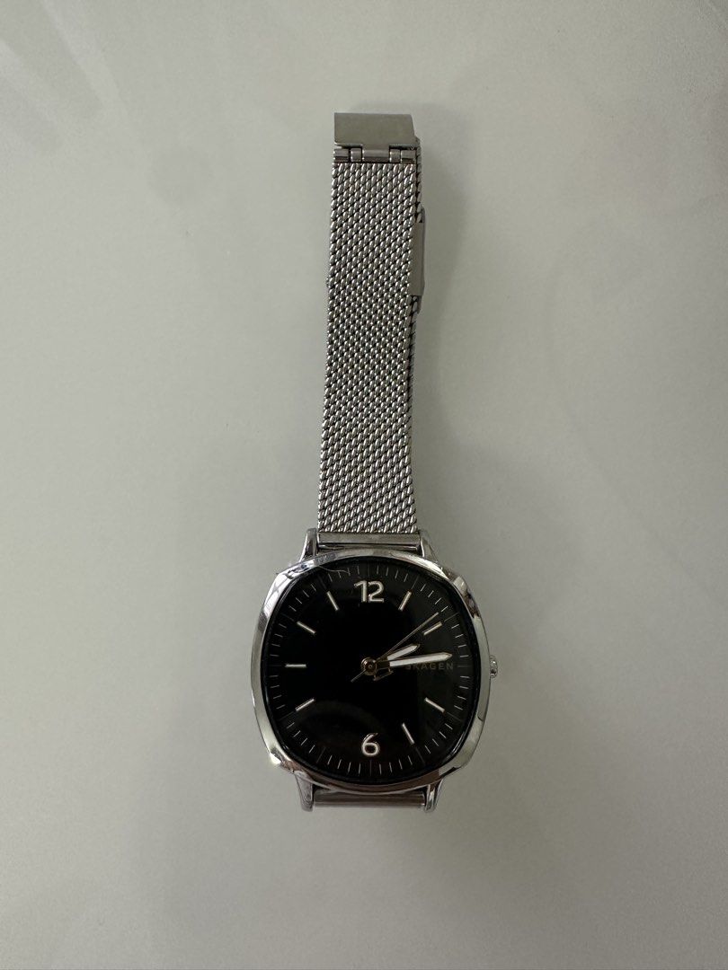 Skagen Silver Mesh Strap Watch with Black Dial (Category: Men's Watches) located in Cavite. Submitted by jazz.shop (Listing ID 1466876487, Image 1). Description: Skagen wristwatch. Silver stainless steel mesh strap. Round polished case with a minimal black dial. White hour markers and hands with silver numbering at the 12 and 6 positions. Adjustable clasp closure. Clean timepiece ready for daily wear..