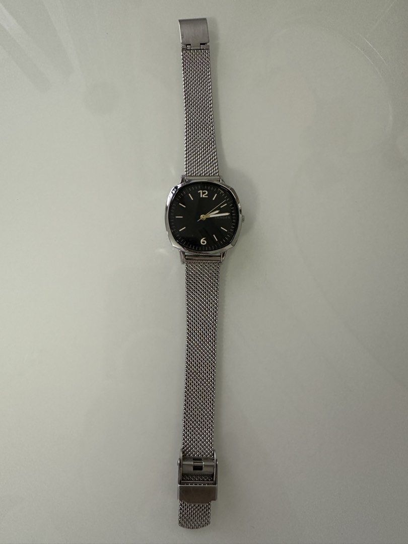 Skagen Silver Mesh Strap Watch with Black Dial (Category: Men's Watches) located in Cavite. Submitted by jazz.shop (Listing ID 1466876487, Image 2). Description: Skagen wristwatch. Silver stainless steel mesh strap. Round polished case with a minimal black dial. White hour markers and hands with silver numbering at the 12 and 6 positions. Adjustable clasp closure. Clean timepiece ready for daily wear..