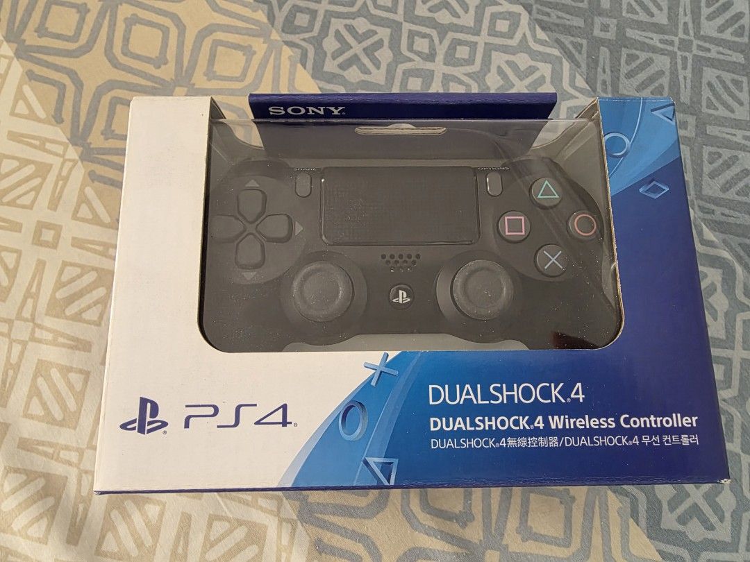 Sony PlayStation 4 DualShock 4 Wireless Controller (Category: Controllers) located in Manila. Submitted by silienat (Listing ID 1466774416, Image 1). Description: Official Sony PS4 DualShock 4 wireless controller in black. Brand new in original retail packaging. Box is unopened, plastic window completely intact. Grab a spare controller for multiplayer gaming or replace an old stick drift controller. Standard layout with textured analog sticks and