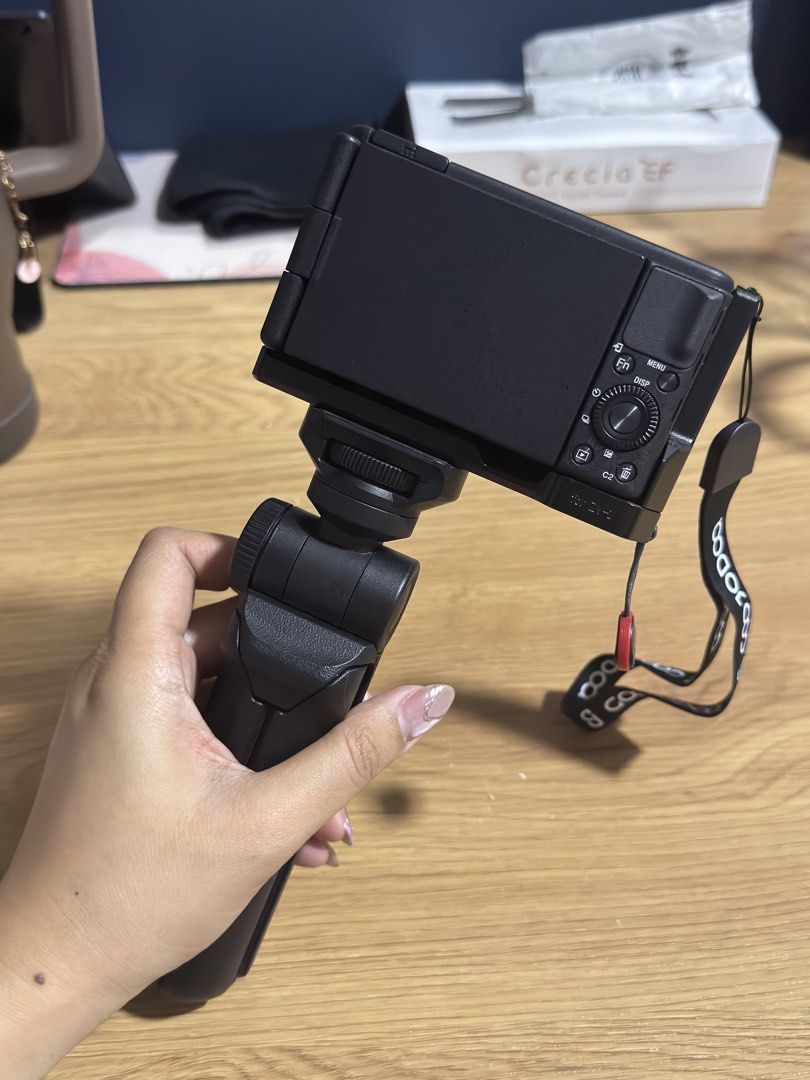 SONY ZV1 (Category: Cameras) located in Imus. Submitted by tinepay (Listing ID 1466783804, Image 3). Description: Selling my well-loved Sony ZV-1. 100% smooth, no issues, and rarely used. Perfect for vlogging and travel. Inclusions: - Original Box - Manuals - Charger - Battery OVER P6,000 WORTH OF FREEBIES: - FREE Godox External Flash - FREE Battery Charger + 2 Extra Battery - FREE Camera Vertical Grip - FREE Sony 64GB Memory card - Upgraded wood