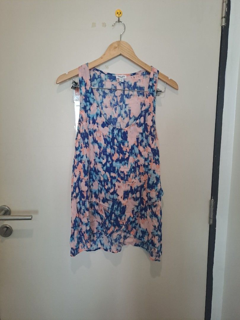Splendid multicolored sleeveless (Category: Sleeveless) located in Manila. Submitted by joanbalde39643 (Listing ID 1466838655, Image 1). Description: This is a lightweight, sleeveless tank top by the brand Splendid, featuring a vibrant, painterly watercolor abstract print. The color palette combines shades of navy blue, soft blush pink, sky blue, and white in a brushstroke-style pattern rayon fabric large..