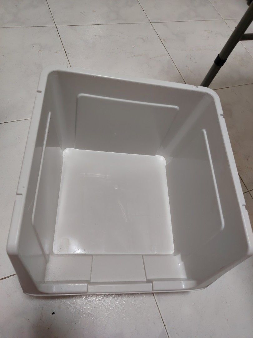 Stackable plastic storage box (Category: Storage Boxes & Baskets) located in Singapore. Submitted by fiery_horse (Listing ID 1466851594, Image 2). Description: - 2 pcs avail - Material: Sturdy plastic with neutral grey finish and flip door - Dimensions approx: ~37cm (W) x 39cm (D) x 29.5cm (H) - Stackable design: Ribbed texture on the lid for secure stacking - Ideal for: Organizing clothes, shoes, and daily essentials - Condition: used but not ab
