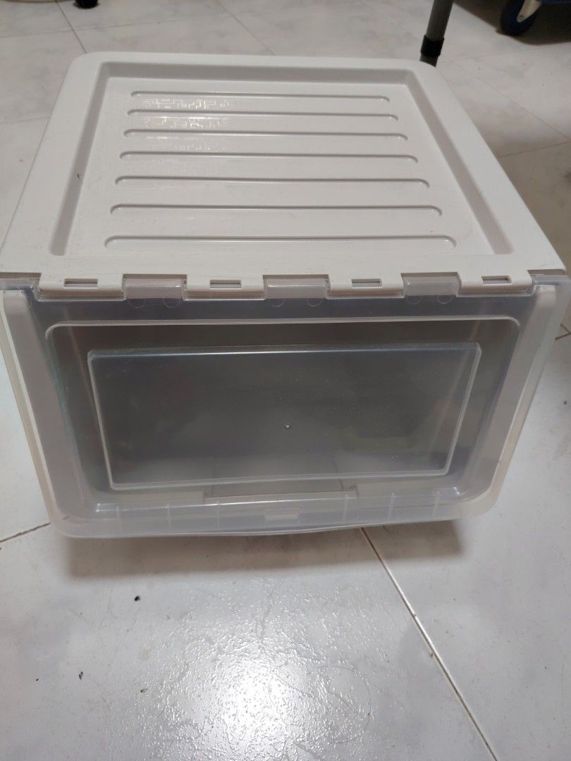 Stackable plastic storage box (Category: Storage Boxes & Baskets) located in Singapore. Submitted by fiery_horse (Listing ID 1466851594, Image 1). Description: - 2 pcs avail - Material: Sturdy plastic with neutral grey finish and flip door - Dimensions approx: ~37cm (W) x 39cm (D) x 29.5cm (H) - Stackable design: Ribbed texture on the lid for secure stacking - Ideal for: Organizing clothes, shoes, and daily essentials - Condition: used but not ab