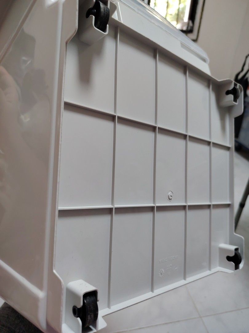 Stackable plastic storage box (Category: Storage Boxes & Baskets) located in Singapore. Submitted by fiery_horse (Listing ID 1466851594, Image 3). Description: - 2 pcs avail - Material: Sturdy plastic with neutral grey finish and flip door - Dimensions approx: ~37cm (W) x 39cm (D) x 29.5cm (H) - Stackable design: Ribbed texture on the lid for secure stacking - Ideal for: Organizing clothes, shoes, and daily essentials - Condition: used but not ab