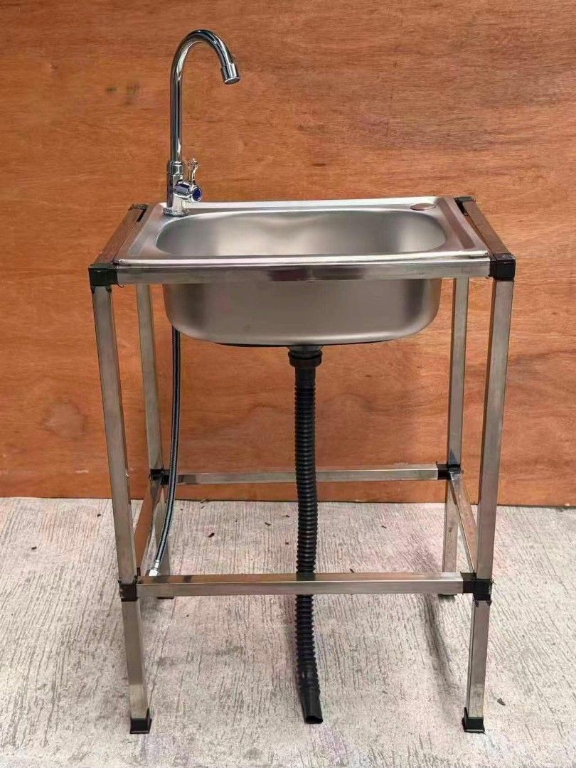 Stainless Steel Kitchen Sink with Stand (Category: Bathroom & Kitchen Fixtures) located in Manila. Submitted by jamfrimzy089458 (Listing ID 1466842875, Image 1). Description: Stainless steel single bowl sink mounted on a sturdy metal frame stand. Includes a tall gooseneck faucet, flexible drainage hose, and a lower storage shelf for kitchen essentials. Easy to assemble, compact setup suitable for indoor or outdoor washing areas. Sturdy legs keep 