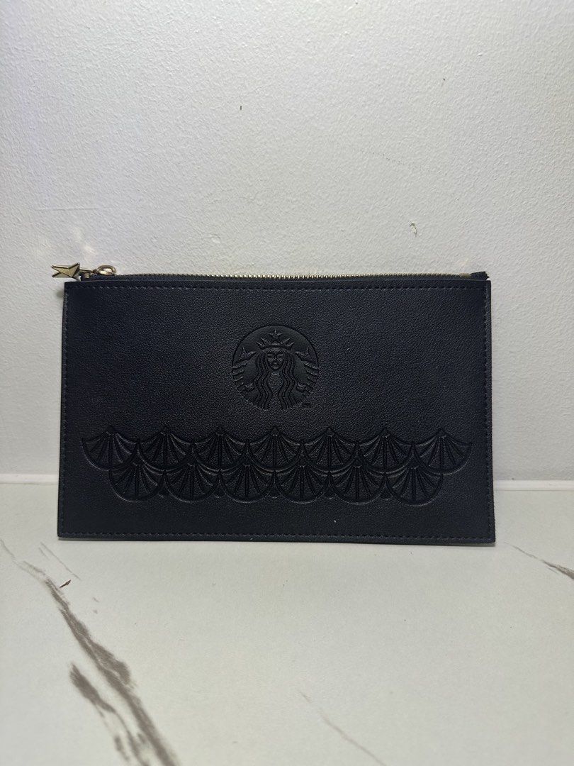 Starbucks Black Leather Zipper Pouch (Category: Purses & Pouches) located in Quezon City. Submitted by swift.thriftz (Listing ID 1466895647, Image 1). Description: - Authentic Starbucks black leather pouch - Features an embossed siren logo and stylish scalloped bottom pattern - Secure top zipper closure with a cute gold-tone star-shaped pull - Perfect for daily use, makeup, or organizing small essentials - RUSH shipping and meet-ups available upo