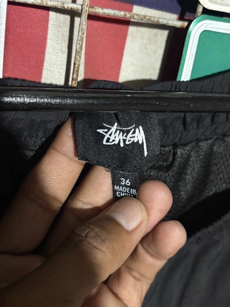 Stüssy Nylon Shorts (Category: Shorts) located in Tuguegarao City. Submitted by urdailyhabitat (Listing ID 1466884791, Image 2). Description: - Brand: Stüssy - Color: Black - Size: 36 (inner tag) - Material: Nylon with mesh lining - Features: Elastic waistband with drawstring, logo print near bottom hem - Condition: Clean, ready to ship - Origin: Made in China.